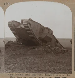 Male Tadpole tank especially designed to cross the Hun trenches moves forward in battle line, 1914-18